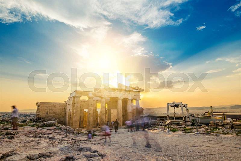 People walking around the ruins of Parthenon, motion blur, stock photo