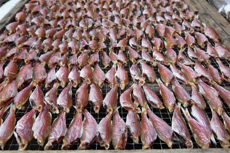 Dried fish at market in Chinese fishing village, stock photo