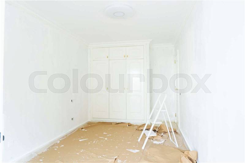 Home renovation concept - old room during restoration or refurbishment with white plaster walls, stock photo