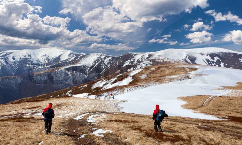 Hiking in the mountains in early spring, stock photo