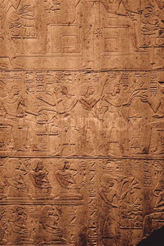 Egyptian Hieroglyphic carvings on the exterior walls of an ancient temple, stock photo