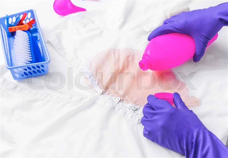 Liquid to remove stains on clothes. Close-up. Preparation for washing, stock photo