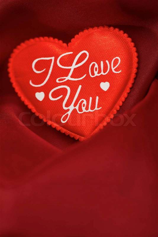 I love you! abstract Valentine\'s backgrounds over red textile with one hearts, stock photo