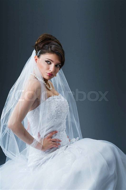 Beautiful bride in studio shooting, stock photo