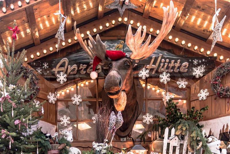 Christmas market hut with elk and Christmas decoration, stock photo
