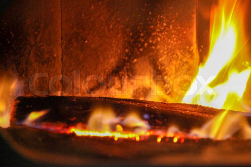 Wood log in a fire place, stock photo