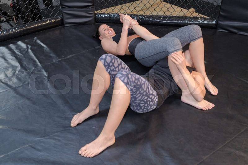 2 women wrestling, stock photo