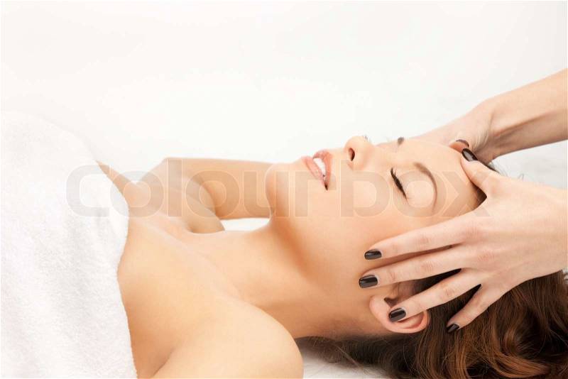Picture of beautiful woman in massage salon, stock photo