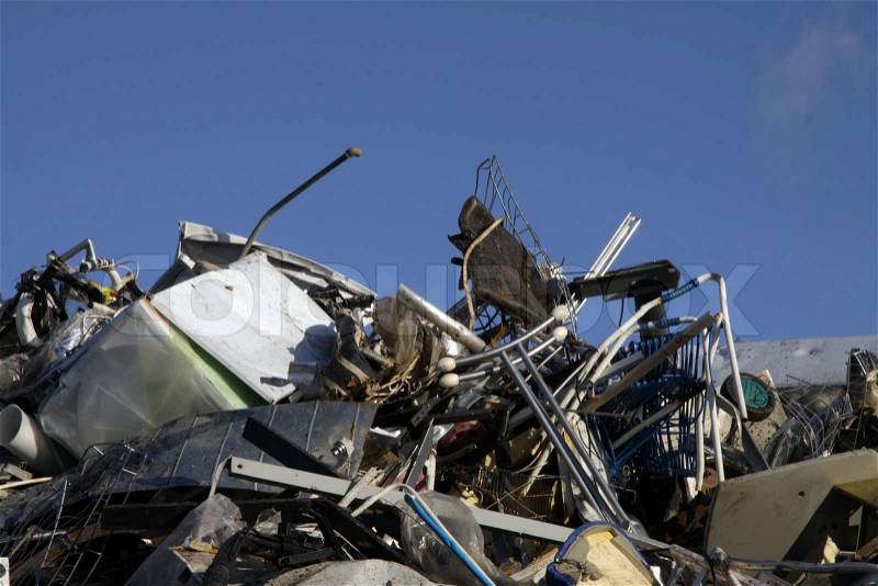 A huge pile of metal waste at a recycling center, stock photo
