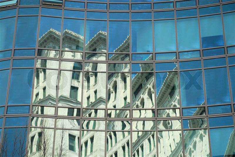Reflection of an Art Deco building in the office facade, New York City, stock photo