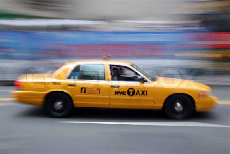 Yellow Taxi rushingthrough New York City, stock photo