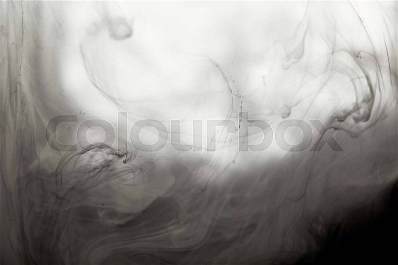 Abstract smoky texture with black paint swirls, stock photo