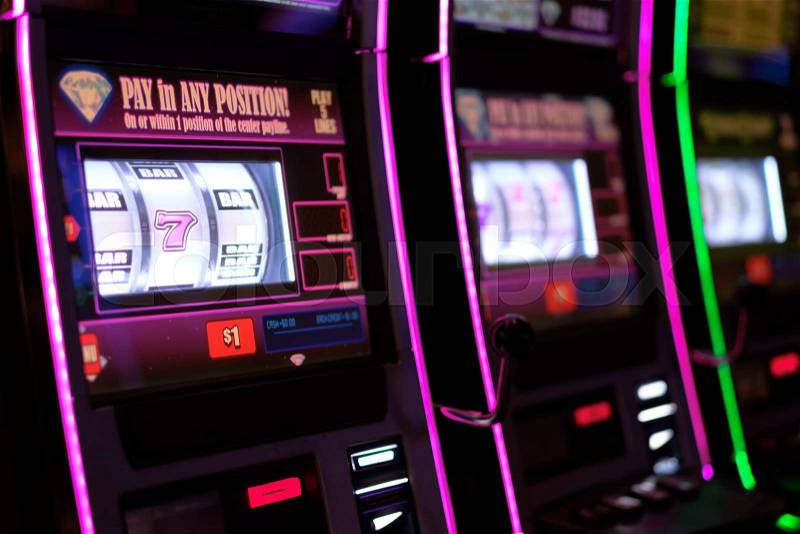 Close up of gaming slot machines in casino, stock photo