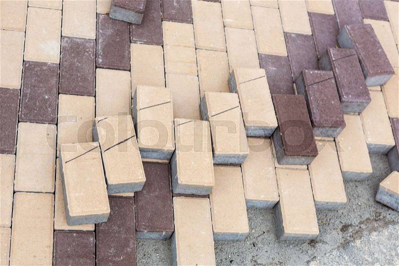 Row of stacks of gray pavement slab on wooden base . Concrete stone paving flag. Public pedestrian area renovation. Lamdcaping and renovation of Walkway zone in city ..., stock photo