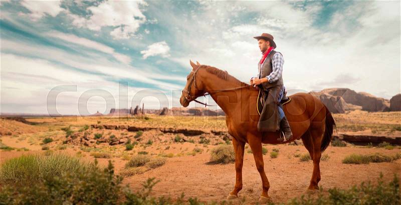 Cowboy in leather clothes riding a horse in desert valley, western. Vintage male rider on horseback, wild west adventure , stock photo