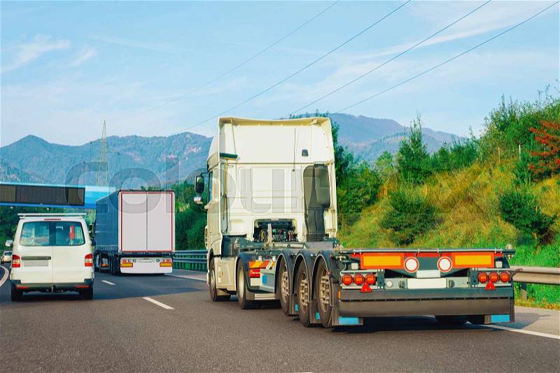 Truck without trailer box on the highway asphalt road in Slovenia. Truck transporter, stock photo