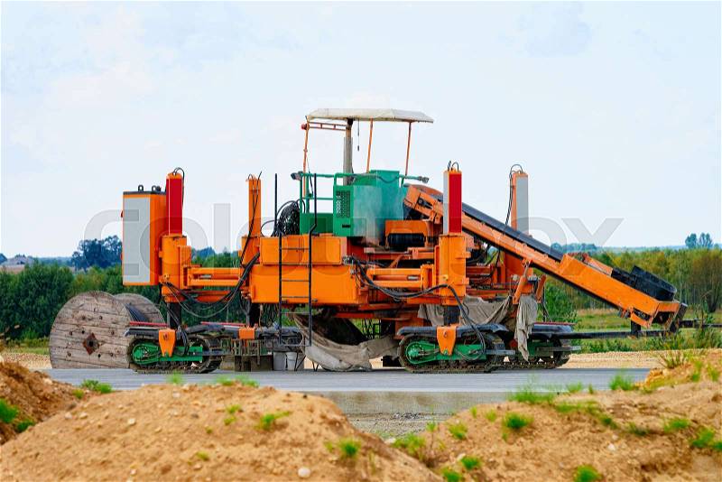 Road milling machine on the highway road in Poland, stock photo