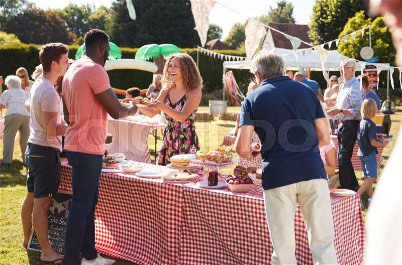 Busy Cake Stall At Summer Garden Fete, stock photo