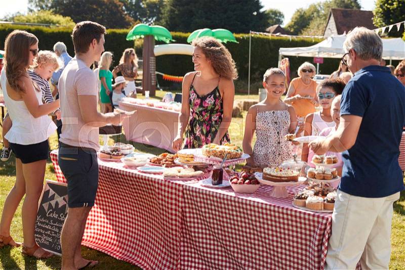 Busy Cake Stall At Summer Garden Fete, stock photo