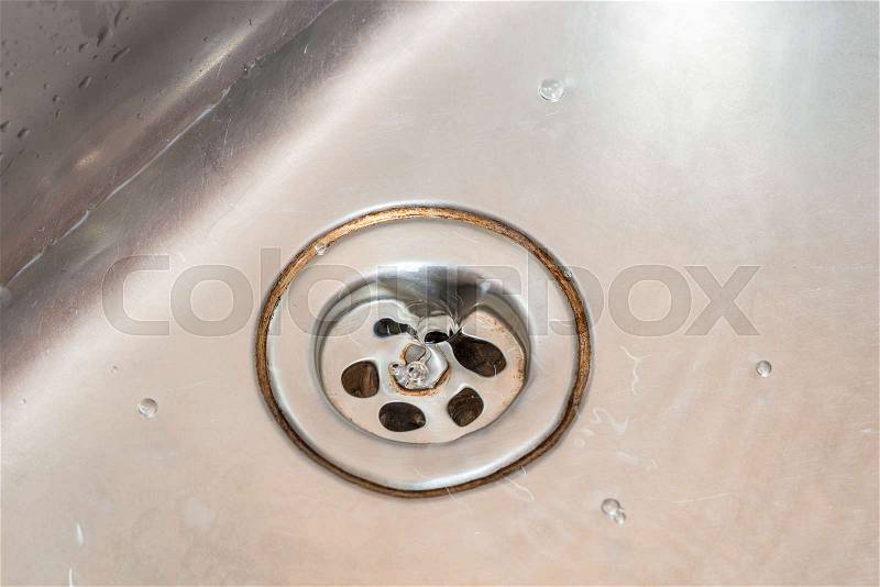 Dirty stainless sinks in the kitchen closeup, stock photo