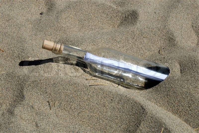 Message in the bottle on the beach, stock photo