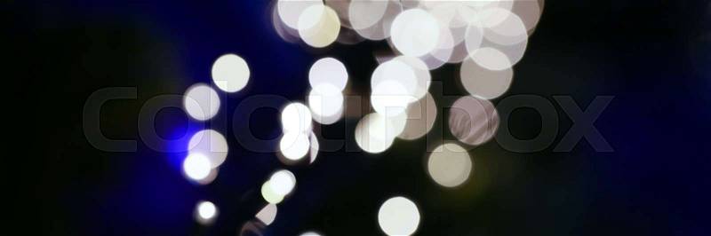 The path of the river of Christmas lights blurred background, stock photo