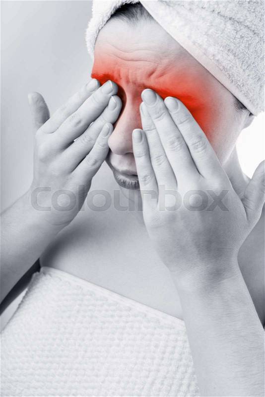 A young woman suffering from pain in the eyes. Black and white image, stock photo