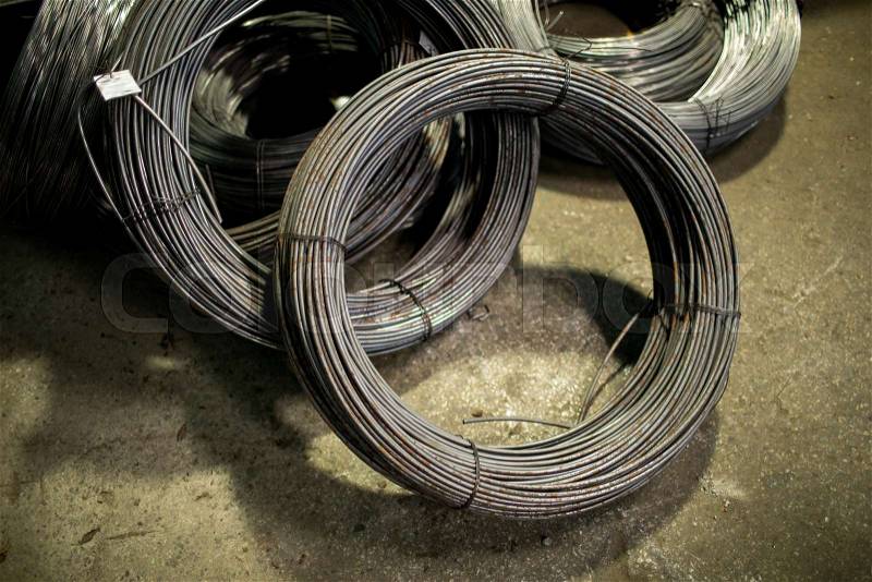 Bunches of iron wire bound into circle and tied up with thin metallic threads, stock photo
