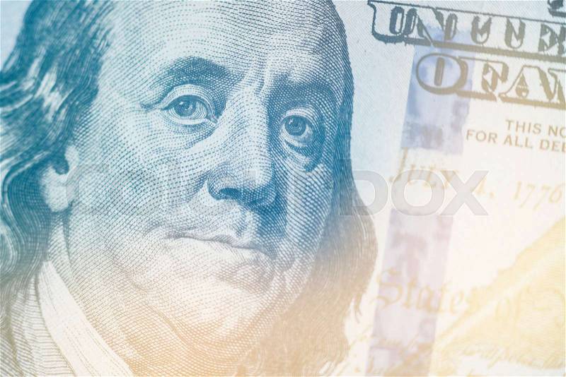 Macro close up of Light toning Ben Franklin\'s face on the US 100 dollar bill, stock photo