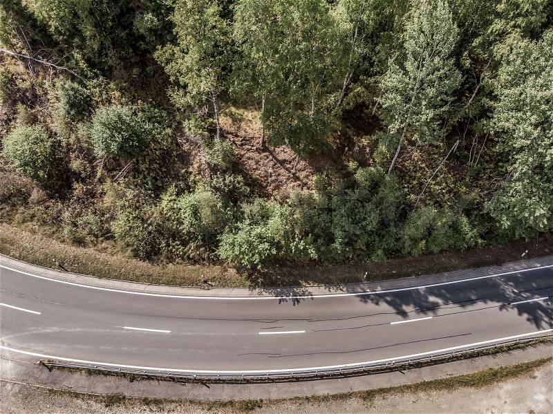 Aerial view of a lonely asphalted country road in the Harz Mountains , stock photo