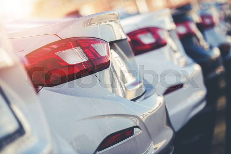 Car Factory Outlet. Row of Brand New Vehicles Ready to Dealership Distribution, stock photo