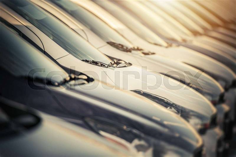 Selection of Brand New Cars in a Row. Dealership Lot Closeup. Automotive Industry Theme, stock photo