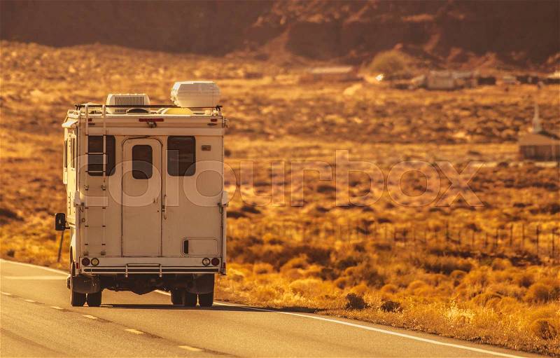 Truck Camper Road Trip Through the Northern Arizona. RV Recreational Vehicles and Travel Industry Theme, stock photo