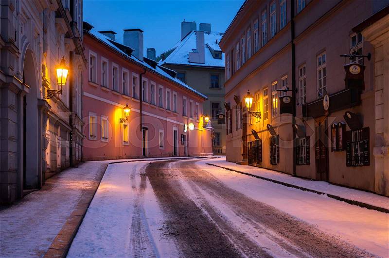 Empty street in winter Prague, Czech Republic. City covered with fresh snow, stock photo