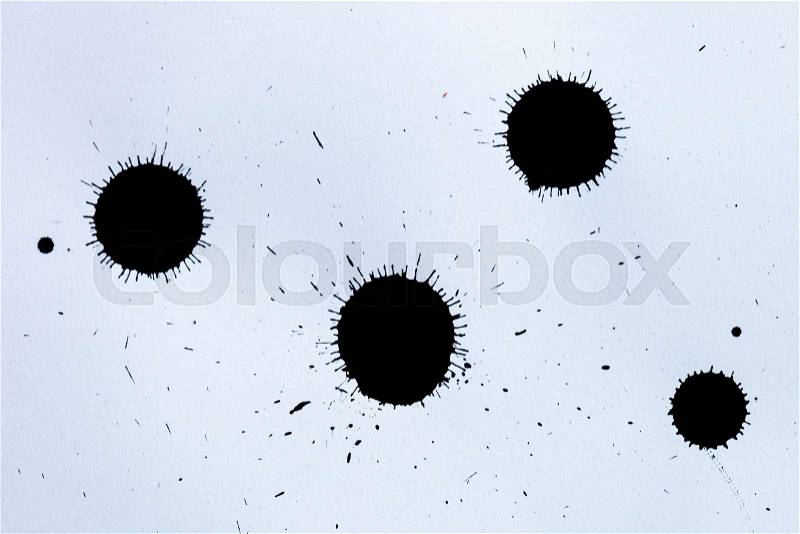 Black ink splashes on white textured paper for brushes and graphic design, stock photo