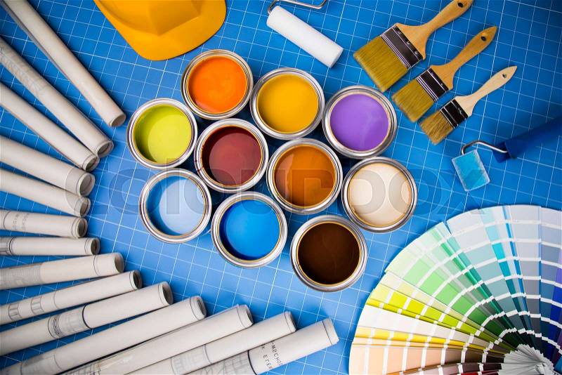 Open cans of paint,Brush, blue background, stock photo