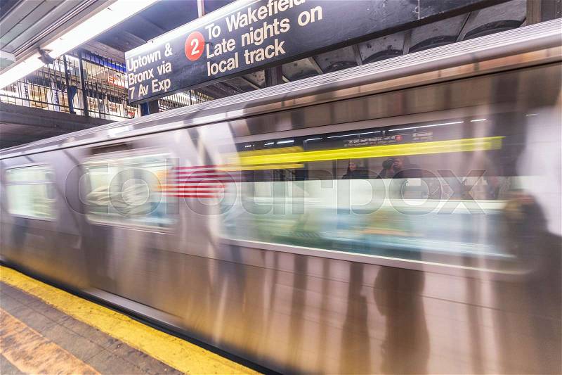 NEW YORK CITY - DECEMBER 1, 2018: Subway train moves fast in the station. Opened in 1904, the New York City Subway is one of the world\'s oldest public transit ..., stock photo