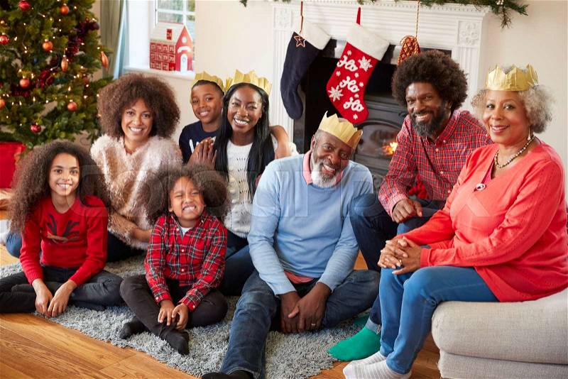 Portrait Of Multi Generation Family Sitting In Lounge At Home On Christmas Day, stock photo