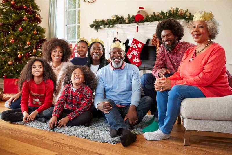Portrait Of Multi Generation Family Sitting In Lounge At Home On Christmas Day, stock photo