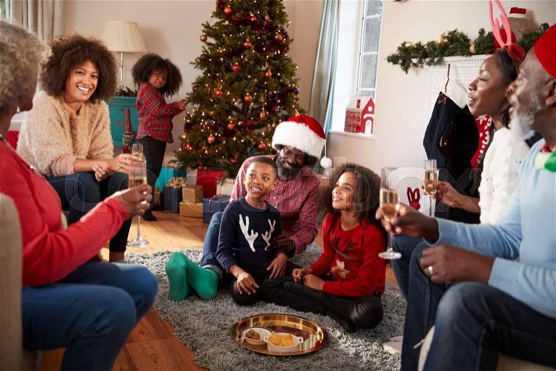 Multi Generation Family Celebrate Christmas At Home Together, stock photo