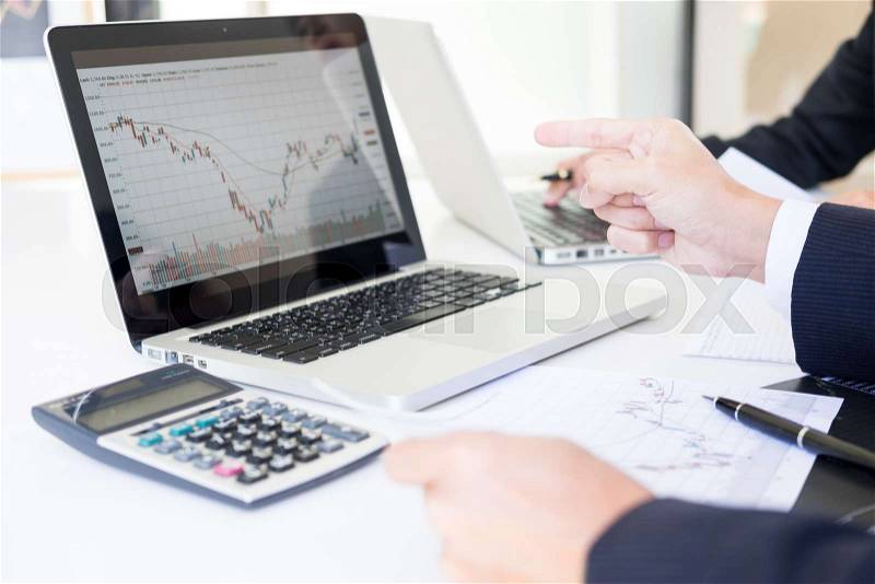 Business Team trader or broker Investment Entrepreneur colleagues working discussing and analysis graph stock market trading with forex chart data, financial, ..., stock photo