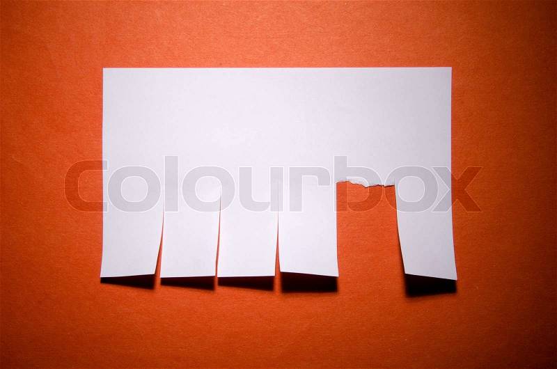 Tear off paper notice on the wall, stock photo