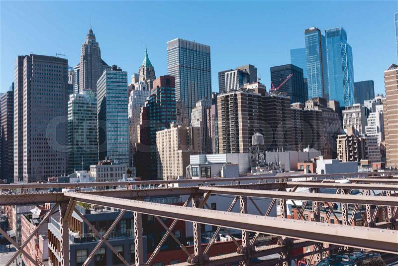 Urban scene of manhattan from brooklyn bridge in new york, usa, stock photo
