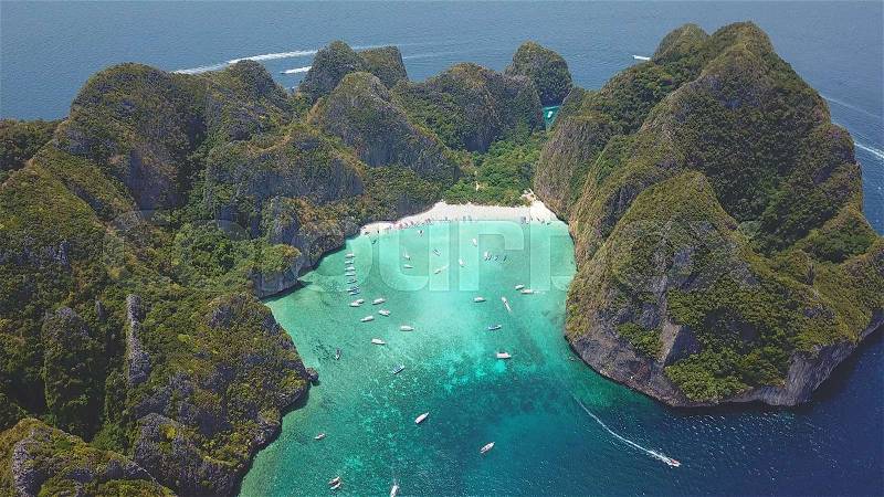 Aerial drone view of tropical turquoise water Maya Bay and limestone cliffs, Phi Phi islands, Thailand, stock photo