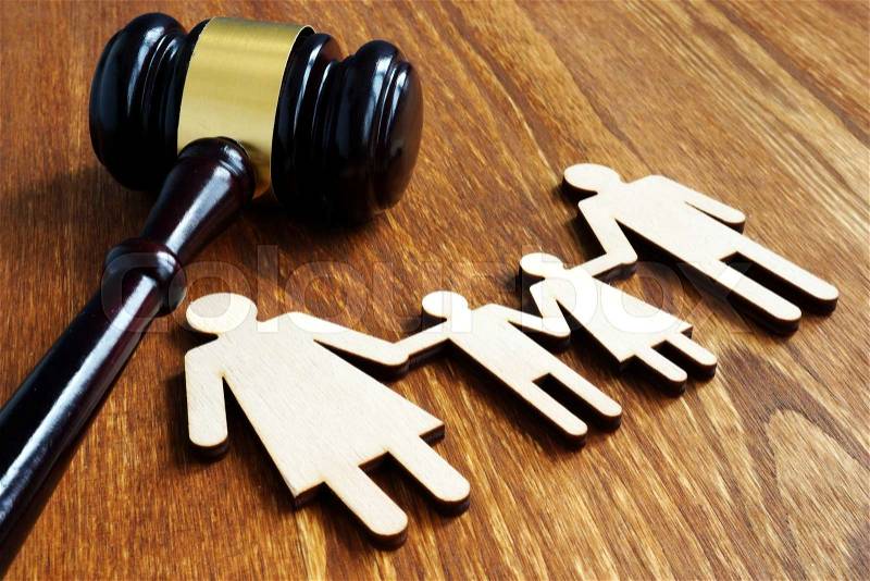 Family law concept. Wooden figures and gavel, stock photo