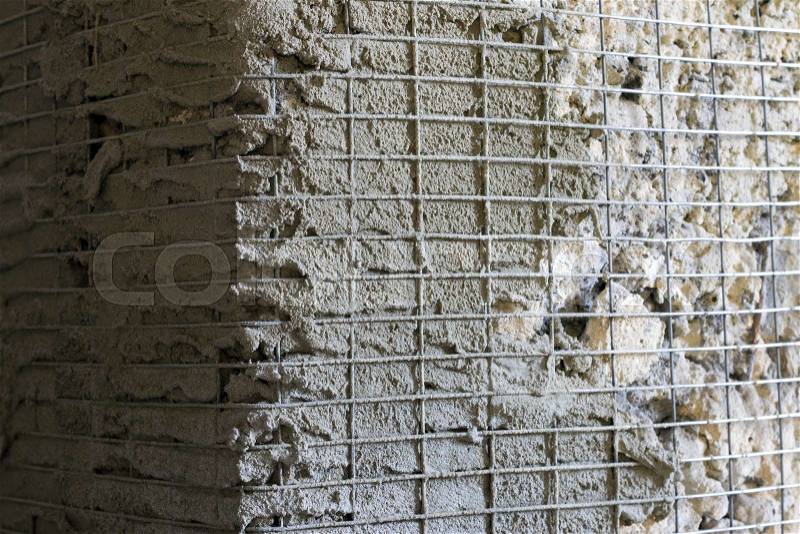 Reinforcement corner with metal mesh. Old wall repair. Architecture lattice base construction, stock photo