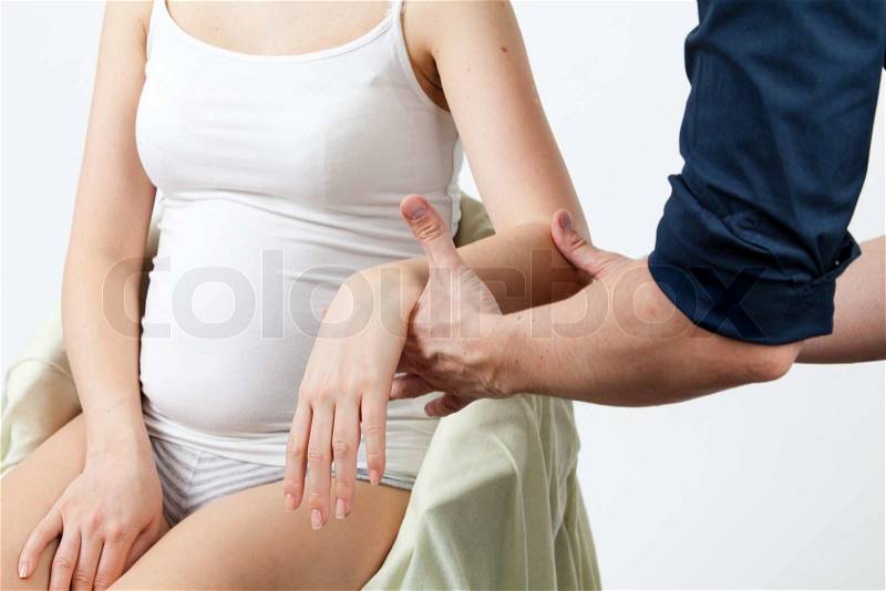 Massage therapist giving a massage female receiving professional massage Series, stock photo