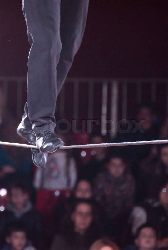 A man walks in a rope in a circus. , stock photo