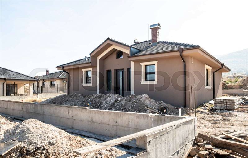 New build houses. Sunny day. Construction site, stock photo