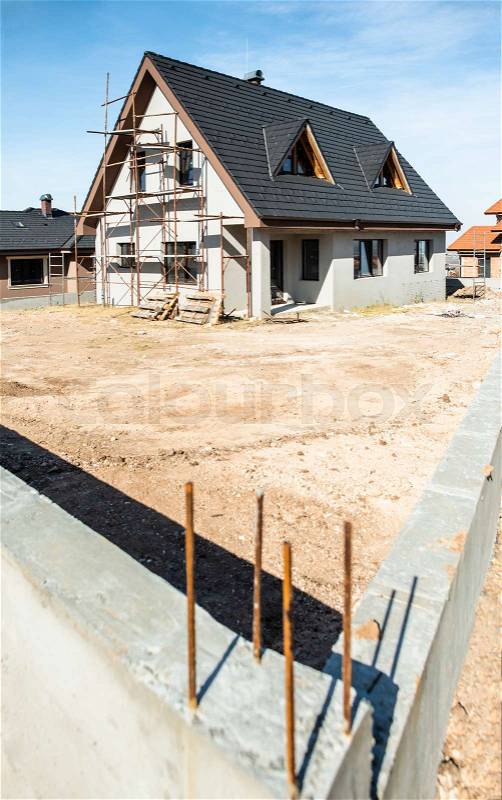 New build houses. Black roof, mountain, stock photo